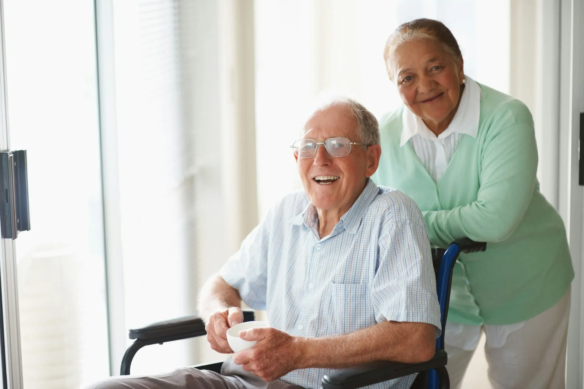 A Nurses & Company caregiver providing around-the-clock support at home