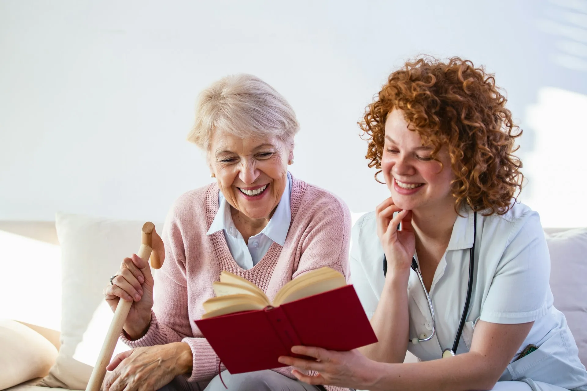 A Nurses & Company caregiver helping an older adult with daily personal care at home
