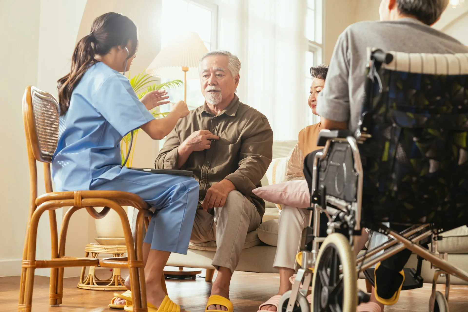 A Nurses & Company caregiver supporting an older adult recovering at home after a hospital stay