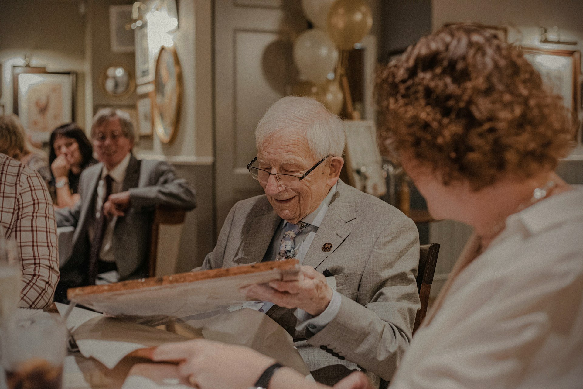 An older adult celebrating with family in their community